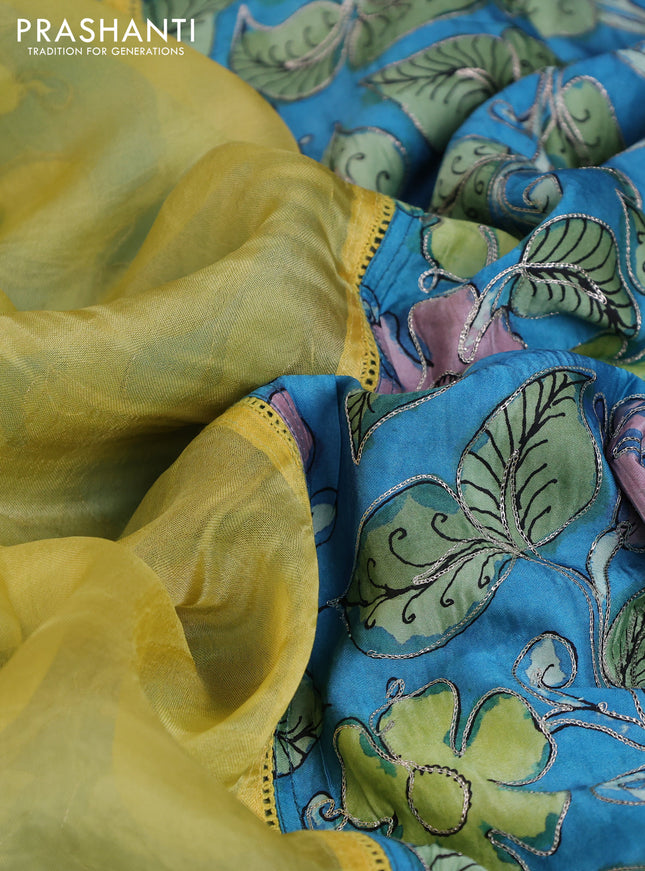 Pure organza silk saree yellow and cs blue with plain body and kalamkari printed pita work border