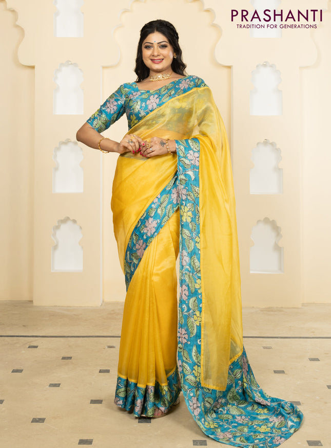 Pure organza silk saree yellow and cs blue with plain body and kalamkari printed pita work border