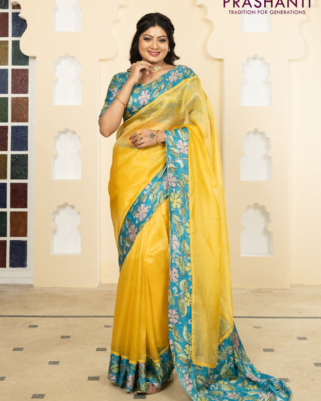Pure organza silk saree yellow and cs blue with plain body and kalamkari printed pita work border