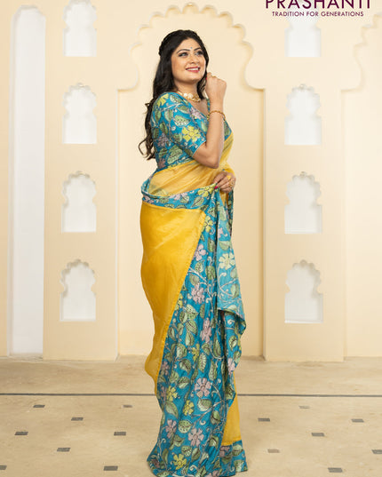 Pure organza silk saree yellow and cs blue with plain body and kalamkari printed pita work border