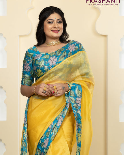 Pure organza silk saree yellow and cs blue with plain body and kalamkari printed pita work border