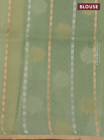 Banarasi organza silk saree pastel green with silver & gold zari weaves and zari woven piping boder