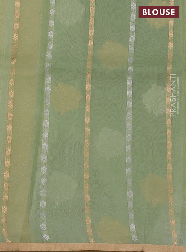 Banarasi organza silk saree pastel green with silver & gold zari weaves and zari woven piping boder