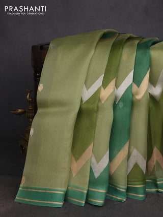 Banarasi organza silk saree pastel green and green with rangakt weaves and zari woven simple border