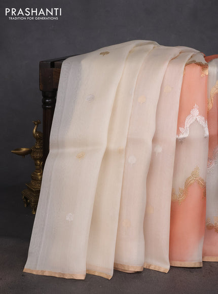 Banarasi organza silk saree off white and peach orange with rangakt weaves and zari woven piping boder