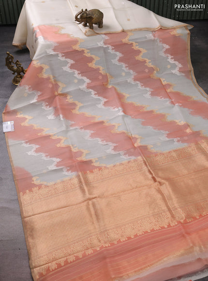 Banarasi organza silk saree off white and peach orange with rangakt weaves and zari woven piping boder