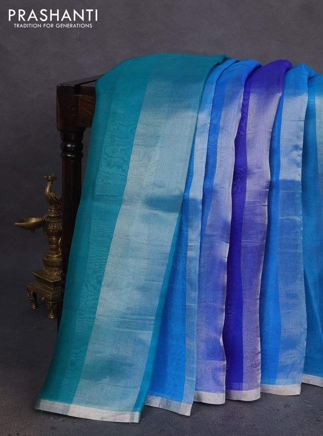 Pure organza silk saree teal blue and cs blue with allover silver zari stripes pattern and zari woven piping boder