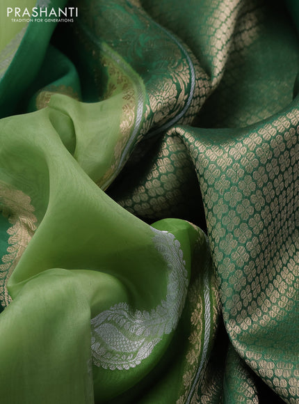 Banarasi organza silk saree green shade with allover silver & gold zari weaves and zari woven piping boder