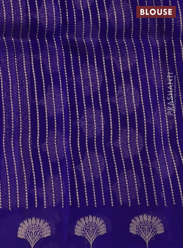 Banarasi organza silk saree blue with zari woven floral buttas and zari woven butta border