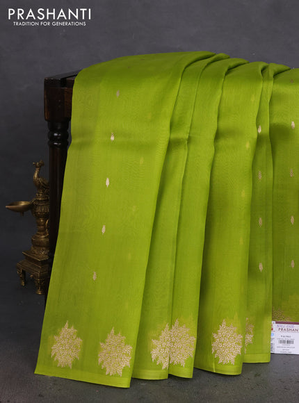 Banarasi organza silk saree light green with zari woven floral buttas and zari woven butta border