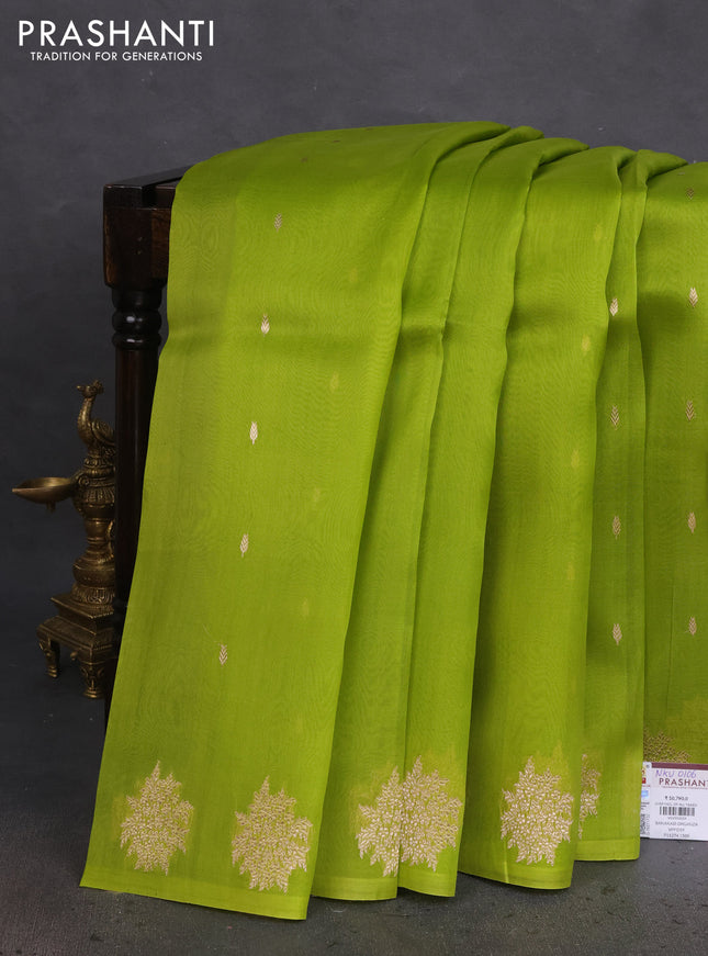 Banarasi organza silk saree light green with zari woven floral buttas and zari woven butta border