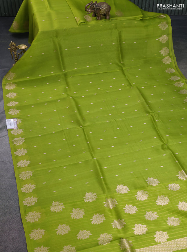 Banarasi organza silk saree light green with zari woven floral buttas and zari woven butta border