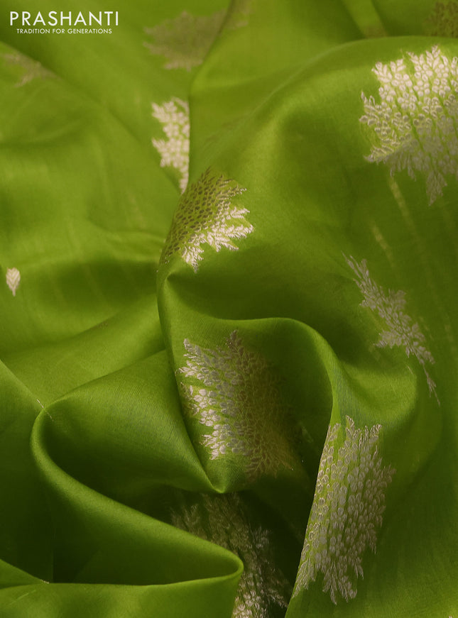 Banarasi organza silk saree light green with zari woven floral buttas and zari woven butta border