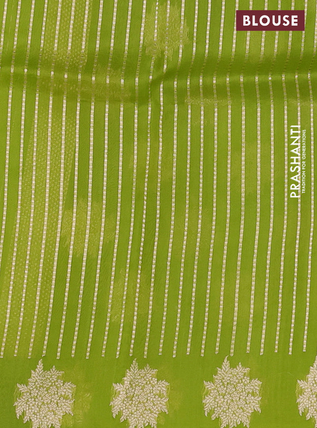 Banarasi organza silk saree light green with zari woven floral buttas and zari woven butta border