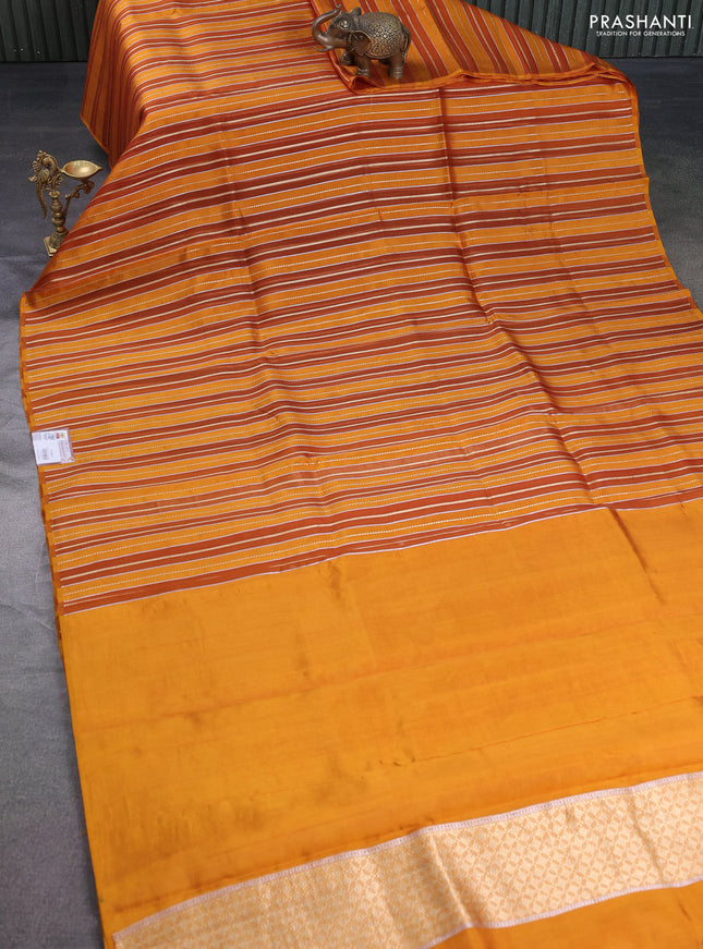 Pure organza silk saree dark mustard with allover zari woven stripes pattern in borderless style