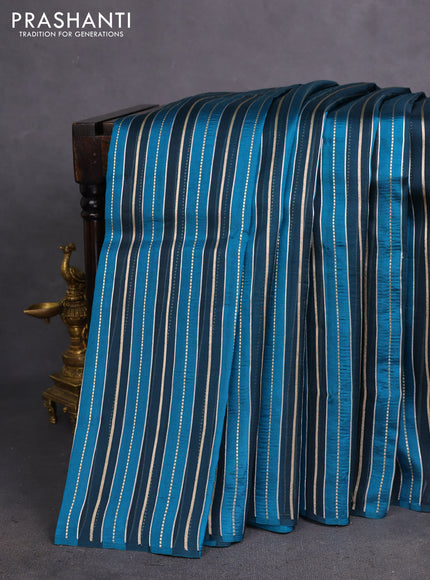 Pure organza silk saree dark peacock blue and peacock blue with allover silver & gold zari woven stripe pattern in borderless style