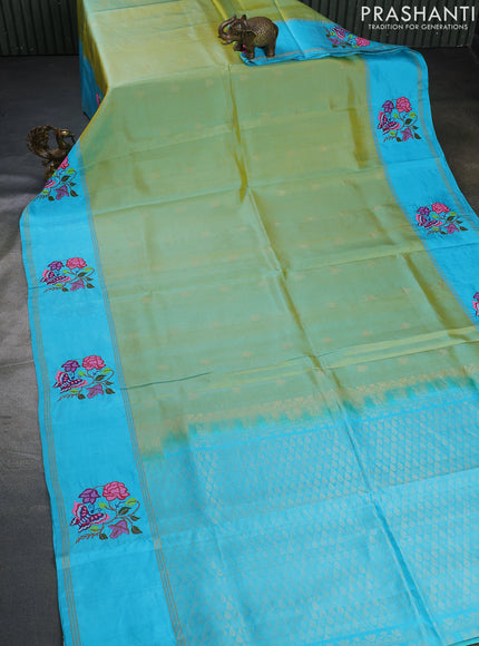 Pure soft silk saree dual shade of teal bluish yellow and teal blue with zari woven floral buttas and zari woven embroidery butta border