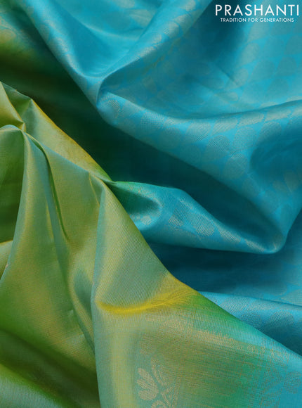 Pure soft silk saree dual shade of teal bluish yellow and teal blue with zari woven floral buttas and zari woven embroidery butta border