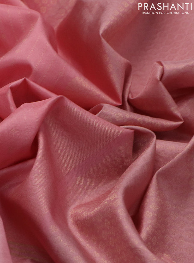 Pure soft silk saree peach pink and peastel peach pink with allover zari weaves and zari woven embroidery butta border