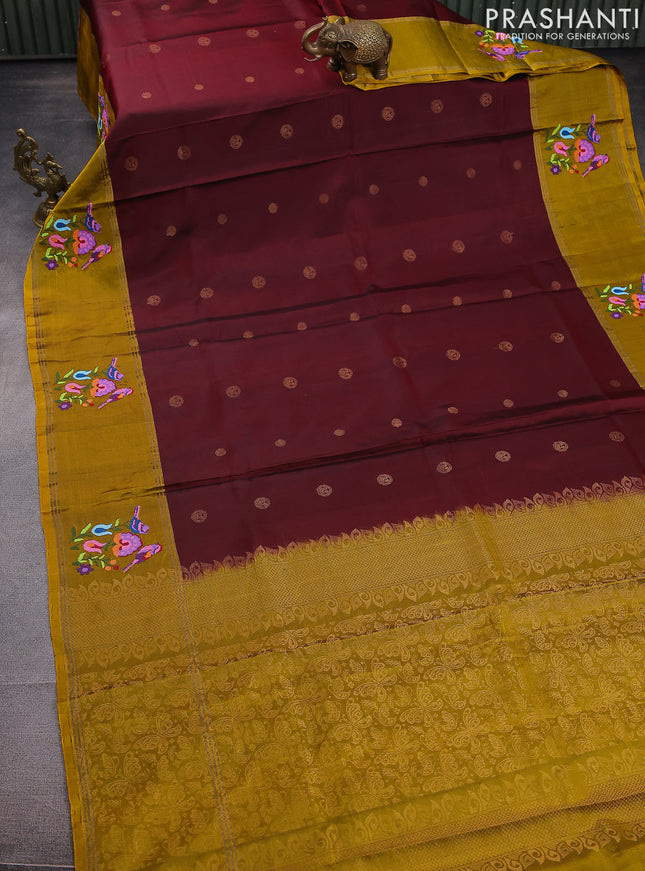Pure soft silk saree maroon and mustard yellow with zari woven buttas and zari woven embroidery butta border