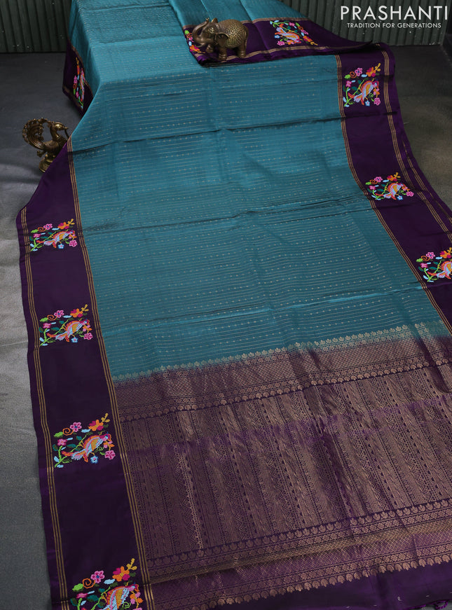 Pure soft silk saree peacock green shade and purple with allover zari weaves and zari woven embroidery butta border