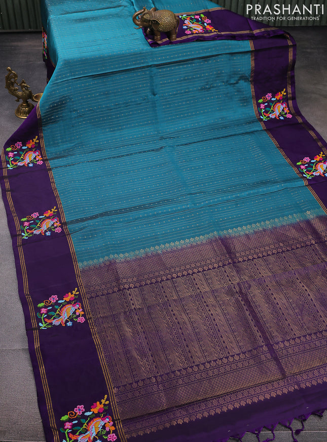 Pure soft silk saree teal blue shade and violet with allover zari weaves and zari woven embroidery butta border