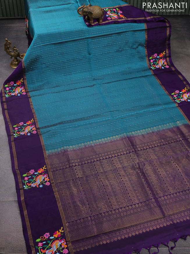 Pure soft silk saree teal blue shade and violet with allover zari weaves and zari woven embroidery butta border