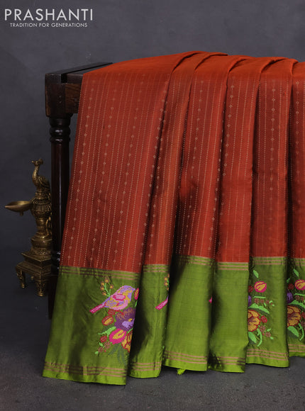 Pure soft silk saree rust shade and mehendi green with allover zari weaves and zari woven embroidery butta border