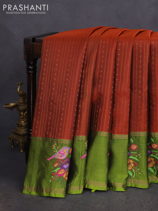 Pure soft silk saree rust shade and mehendi green with allover zari weaves and zari woven embroidery butta border