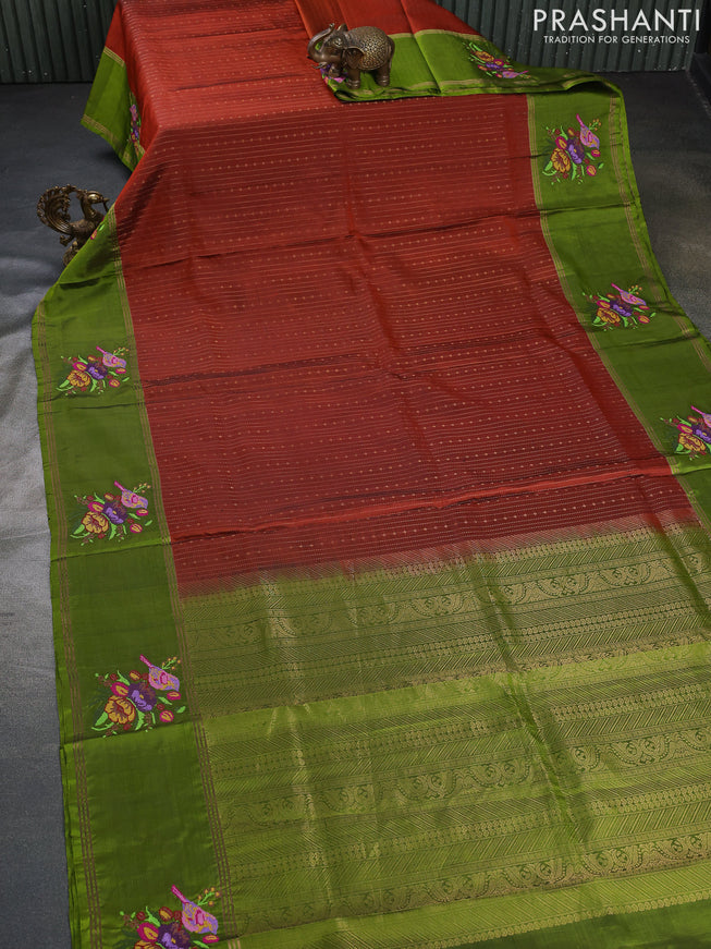 Pure soft silk saree rust shade and mehendi green with allover zari weaves and zari woven embroidery butta border