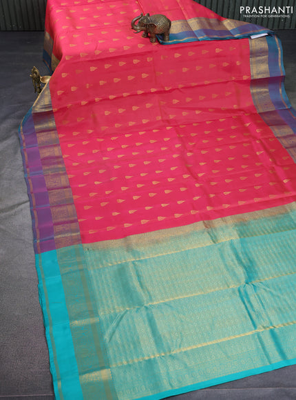 Kanchipuram silk saree peach pink and dual shade of teal green with zari woven buttas and zari woven border