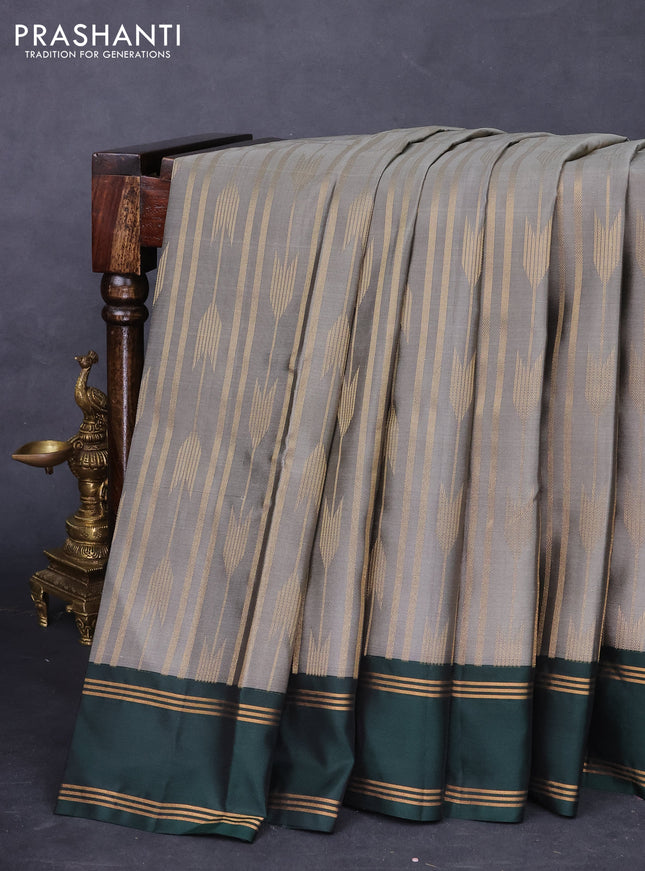 Kanchipuram silk saree grey and dark green with allover zari weaves and rettapet zari woven border