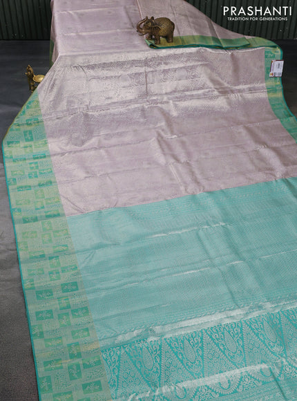 Pure kanchipuram tissue silk saree pastel grey and teal green with allover silver zari woven brocade weaves and silver zari woven border
