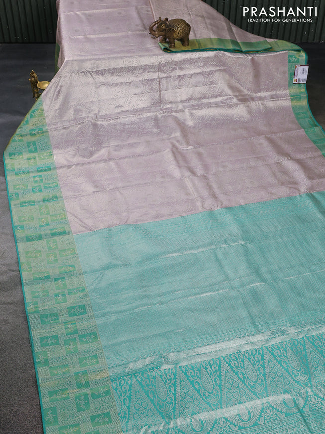 Pure kanchipuram tissue silk saree pastel grey and teal green with allover silver zari woven brocade weaves and silver zari woven border