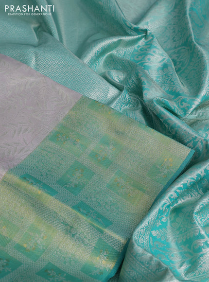 Pure kanchipuram tissue silk saree pastel grey and teal green with allover silver zari woven brocade weaves and silver zari woven border