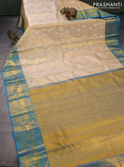 Pure kanchipuram tissue silk saree gold and cs blue with allover silver zari woven brocade weaves and zari woven border