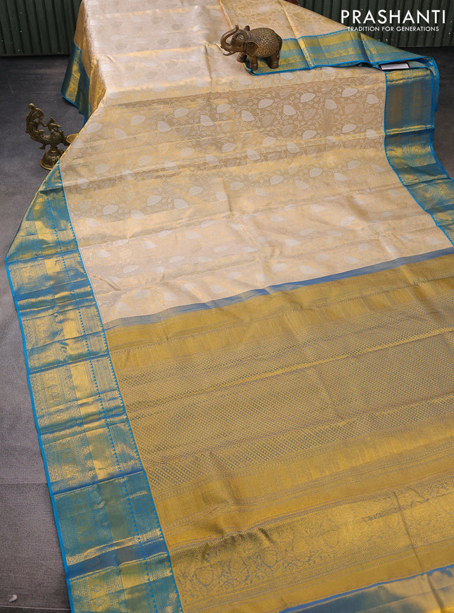 Pure kanchipuram tissue silk saree gold and cs blue with allover silver zari woven brocade weaves and zari woven border