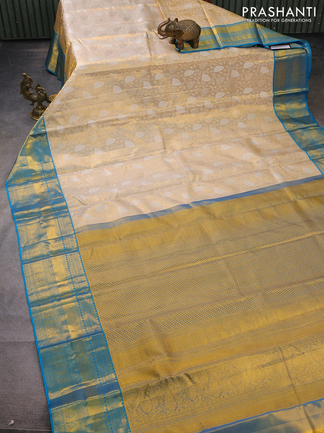 Pure kanchipuram tissue silk saree gold and cs blue with allover silver zari woven brocade weaves and zari woven border