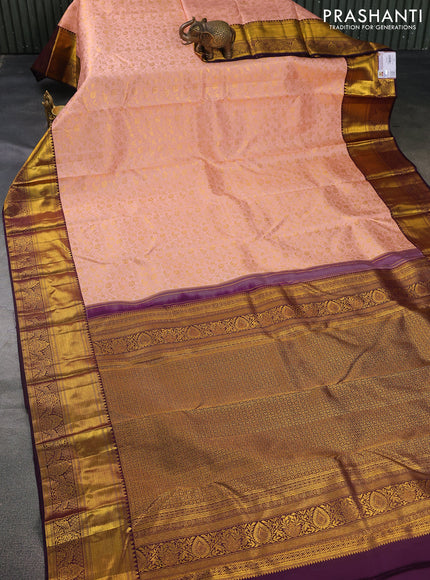 Pure kanchipuram silk saree peach shade and wine shade with allover zari woven brocade weaves and zari woven border