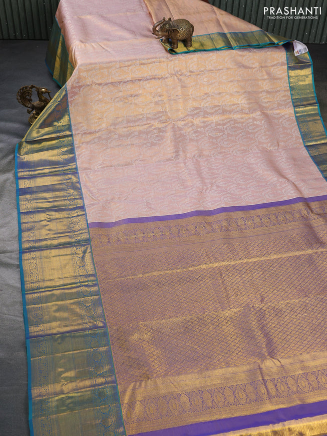 Pure kanchipuram tissue silk saree mild peach and dual shade of bluish green with allover silver zari woven brocade weaves and long zari woven border