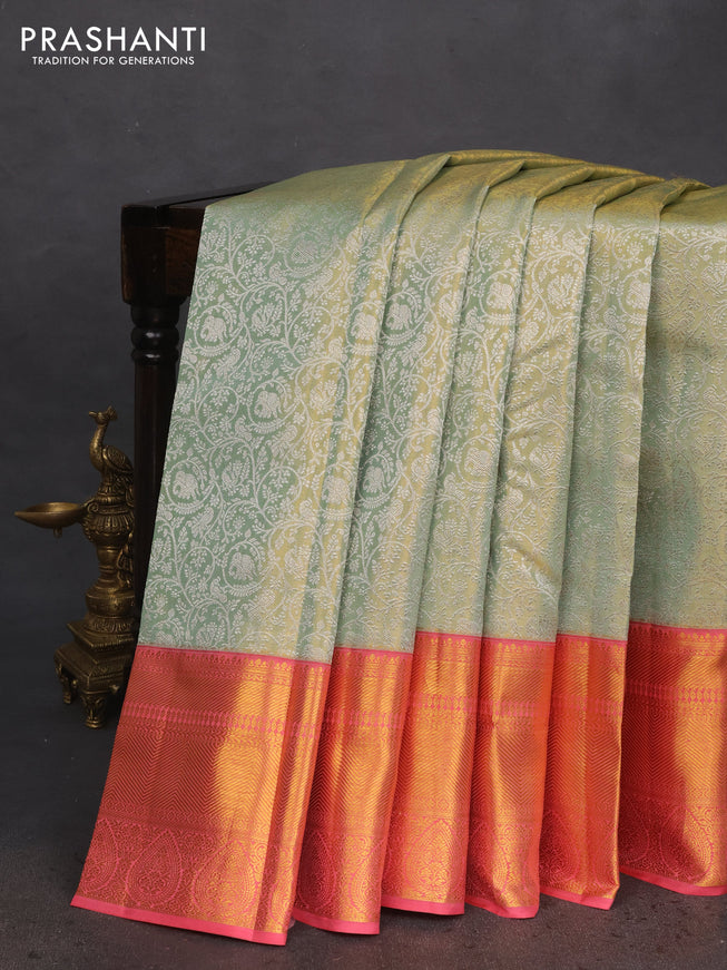 Pure kanchipuram tissue silk saree pastel green and peach pink with allover silver zari woven brocade weaves and long zari woven border