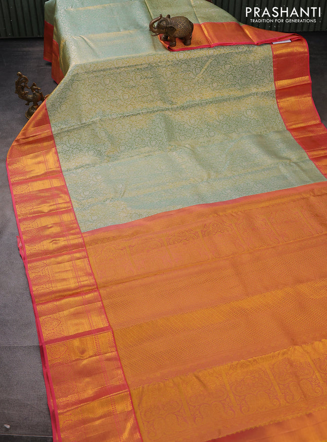 Pure kanchipuram tissue silk saree pastel green and peach pink with allover silver zari woven brocade weaves and long zari woven border