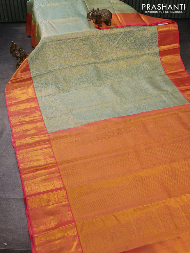 Pure kanchipuram tissue silk saree pastel green and peach pink with allover silver zari woven brocade weaves and long zari woven border