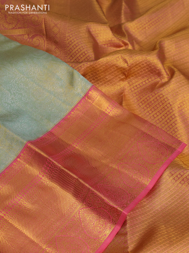 Pure kanchipuram tissue silk saree pastel green and peach pink with allover silver zari woven brocade weaves and long zari woven border