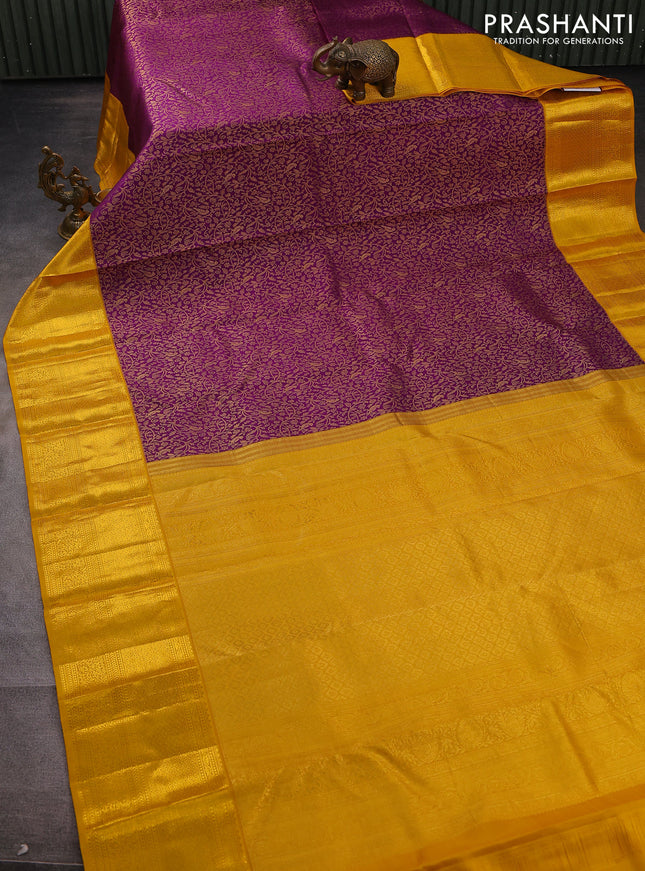 Pure kanchipuram silk saree deep purple and mustard yellow with allover zari woven brocade weaves and zari woven border