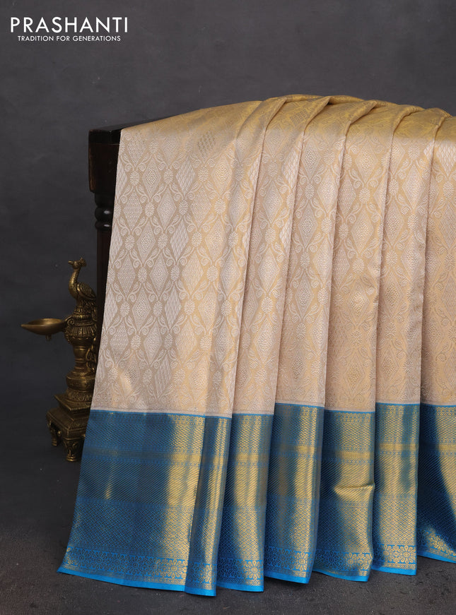 Pure kanchipuram tissue silk saree gold and cs blue with allover silver zari woven brocade weaves and zari woven border