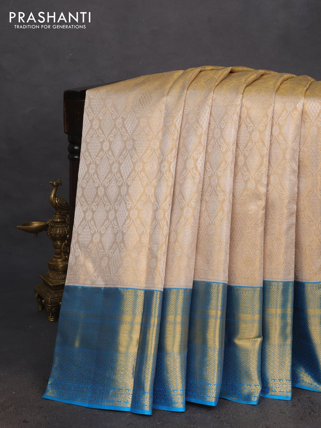 Pure kanchipuram tissue silk saree gold and cs blue with allover silver zari woven brocade weaves and zari woven border