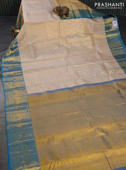 Pure kanchipuram tissue silk saree gold and cs blue with allover silver zari woven brocade weaves and zari woven border