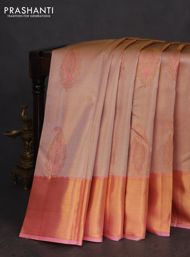 Pure kanchipuram tissue silk saree dual shade of peach pink with allover zari woven brocade weaves and zari woven border
