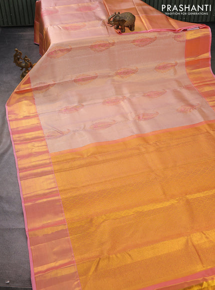 Pure kanchipuram tissue silk saree dual shade of peach pink with allover zari woven brocade weaves and zari woven border